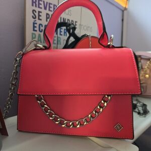 Stylish Pink Handbag with Chain Detail
